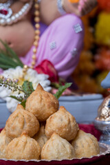 Fototapeta na wymiar Ganesh Puja - Sweet Modak food offered on Ganpati festival or Chaturthi in India
