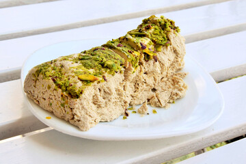 Exquisite food. Halva with peanuts lies on a plate