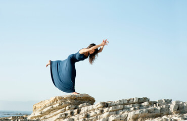 Beautiful Woman Sea Balance Yoga Pose