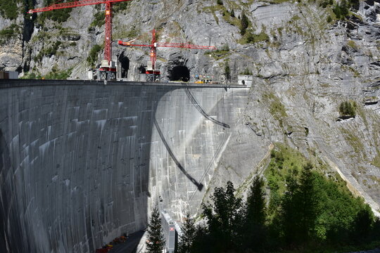 Huge wall of Gigerwald Dam which stands between rock faces of the Ringelspitz massif. Concrete dam is situated in wild narrow mountain Tamina Valley in Bad Ragaz.