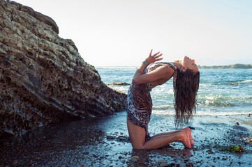 Sensual Sea Woman Yoga Pose On The Shore