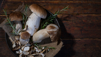 Dark food photography background - Forest mushrooms / Boletus edulis (king bolete) / penny bun /...