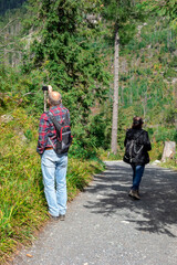 Tourists walk along a mountain trail in the Tatras in Slovakia