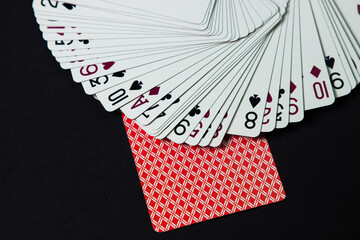 Game cards on a black background. Gambling concept.