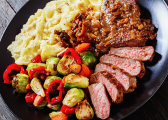 beef steak with potato mash and roasted vegetables