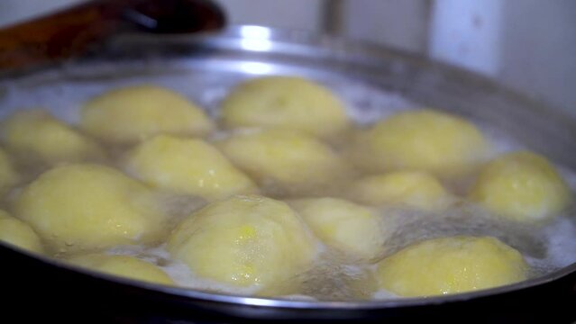 Sweet plum dumpling and a piece of yeast dough. Cooking plum dumplings. The process of making homemade apple and plum galette, hombovci 
