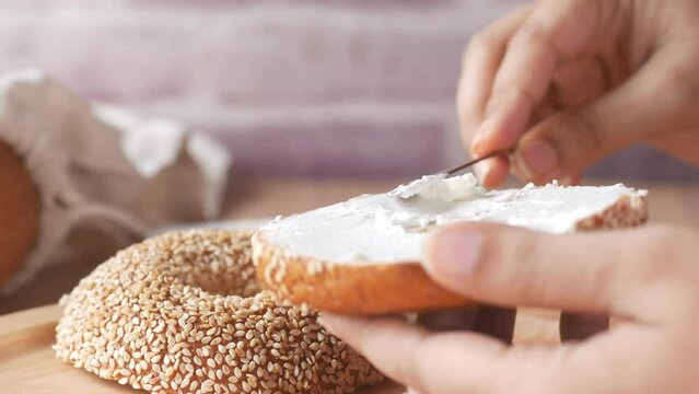 cheese cream spread on fresh bagel bread 