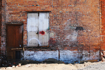 distressed abandoned war empty brick wall warehouse desperate factory entrance disused crisis...