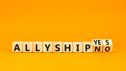 Allyship yes or no symbol. Concept words Allyship yes or Allyship no on wooden cubes. Beautiful orange table orange background. Business Allyship yes or no concept. Copy space.