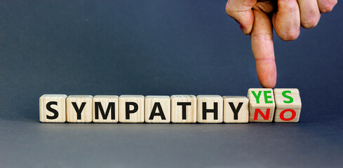 Sympathy yes or no symbol. Concept words Sympathy yes or Sympathy no on wooden cubes. Psychologist...