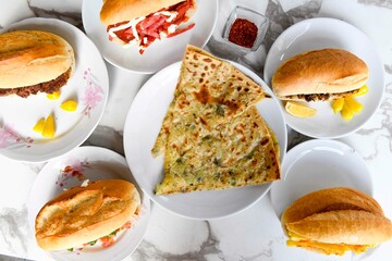Table scene of assorted take out or delivery foods. Traditional Turkish cuisine. Various Turkish meal and appetizers. Top down view on a table.