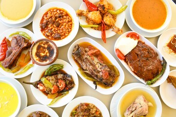 Table scene of assorted take out or delivery foods. Traditional Turkish cuisine. Various Turkish meal and appetizers. Top down view on a table.
