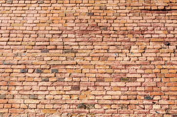 An old brick wall of different colors.