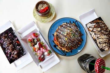 Table scene of assorted take out or delivery foods. Traditional Turkish cuisine. Various Turkish meal and appetizers. Top down view on a table.