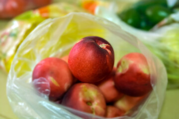 A packet of nectarines. in a A packet of nectarines. In a super transparent bag