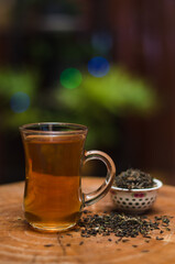 Darjeeling tea cup and traditional pot.