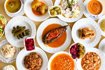 Table scene of assorted take out or delivery foods. Traditional Turkish cuisine. Various Turkish meal and appetizers. Top down view on a table.