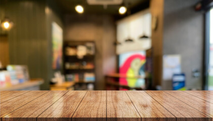 Empty wooden table top with lights bokeh on blur restaurant background.	
