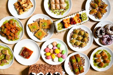 Delicious meat kebab with fresh vegetable salad served with variety of Turkish dishes and appetizers. Top view of assorted Turkish food and meze, tasty and healthy Mediterranean cuisine.