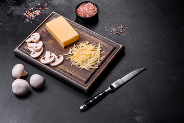 Raw pasta, mushrooms, onions, mince, spices and herbs to make a delicious paste