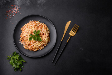 Tasty appetizing classic italian pasta with tomato sauce and cheese on plate on dark background