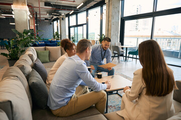 Businessperson holding business meeting in co-working space
