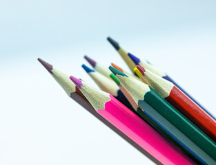 Color pencils on white background, top view with space for text