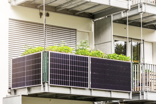 Solar Panels on Balcony of Apartment Building. Modern Balconies House with Solar Cells and Shutters, Blinds.