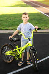 happy boy with bright bike, learning, active lifestyle 