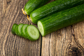 Cucumbers are green on a wooden background.Fresh vegetables. Sale.