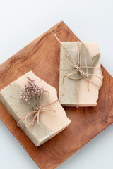 Handmade natural soap on pastel background.