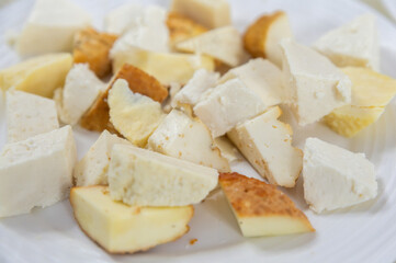 Homemade Caucasian or Circassian cheese cut in slices at local market