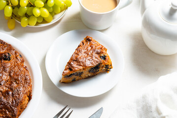 Homemade carrot cake on white wooden table