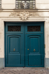 Fototapeta na wymiar An old door in Paris on a sunny day.