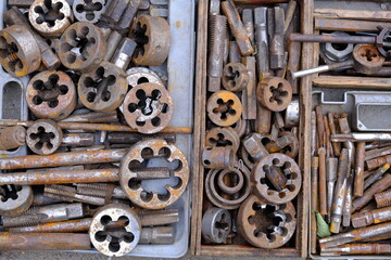 close-up showcasing old rusty metal and brass parts in bulk for decoration or collection, sold at a...