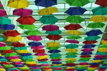 Fototapeta na wymiar Colored umbrellas inside a mall