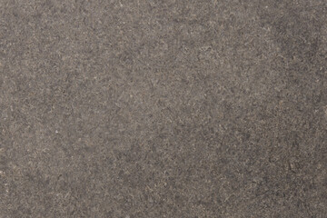 Dark gray flamed granite slab textured background