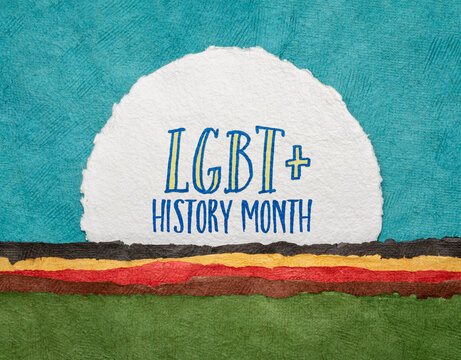 LGBT History Month - handwriting on a handmade watercolor paper against abstract paper landscape, reminder of cultural and heritage event