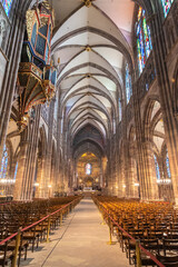Gothic interior of the Strasbourg Cathedral or the Cathedral of Our Lady of Strasbourg (French: Cathédrale Notre-Dame de Strasbourg, German: Liebfrauenmünster zu Straßburg or Straßburger Münster)