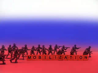 The word mobilization and soldiers on a light background. Mobilization in Russia.