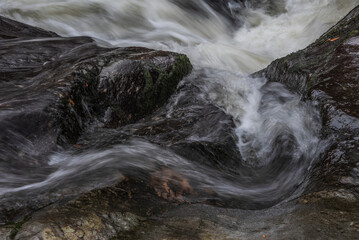Stunning vibrant landscape image of Aira Force Upper Falls in Lake District during colorful Autumn...
