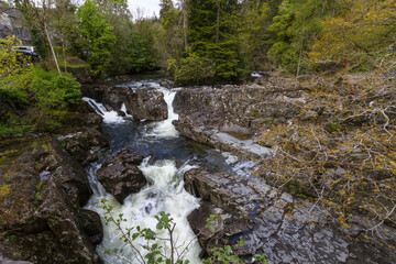Water  flowing over small waterfall.