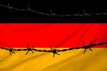 national flag of Germany on textured background, rows of barbed wire, concept of war, revolution, armed uprising in country, increase in crime in state, terrorist attack, redistribution of power