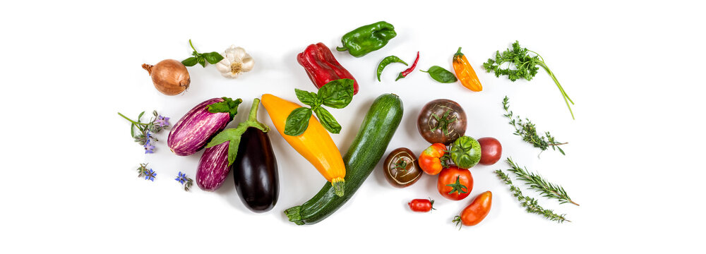 Panoramic - Ingredients to cook a Ratatouille freom Nice France on a cropped white background.