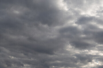 Obraz premium White curly clouds in the blue sky