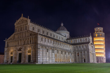 Fototapeta na wymiar Pisa, Italy, 14 April 2022: Cathedral and leaning tower by night