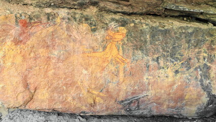 Aboriginal rock art: yellow-infilled, red-outlined, X-ray style kangaroo in Anbangbang Gallery....