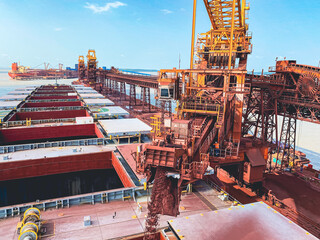 Iron Ore Conveyor Loading Cargo in Cape Size Bulk Carrier