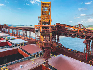 Iron Ore Conveyor Loading Cargo in Cape Size Bulk Carrier © NOEL CABE