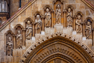 Religious sculptures on the facade of Jak Chapel near Vajdahunyad Castle in Budapest, Hungary © katatonia